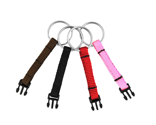 Photo of four quick-release key ring adapters with brown, black, red and pink webbing